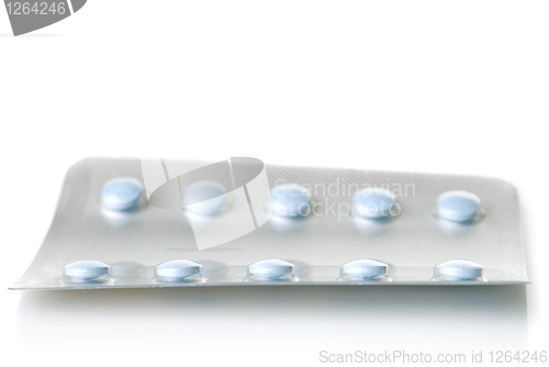 Image of pack of blue tablets isolated on white