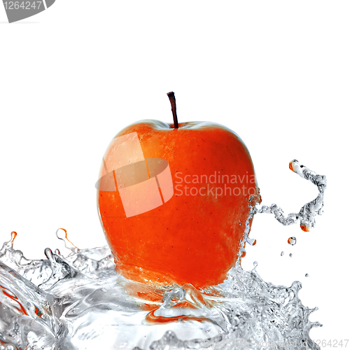 Image of fresh water splash on red apple isolated on white