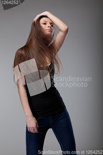 Image of attractive young woman dancing