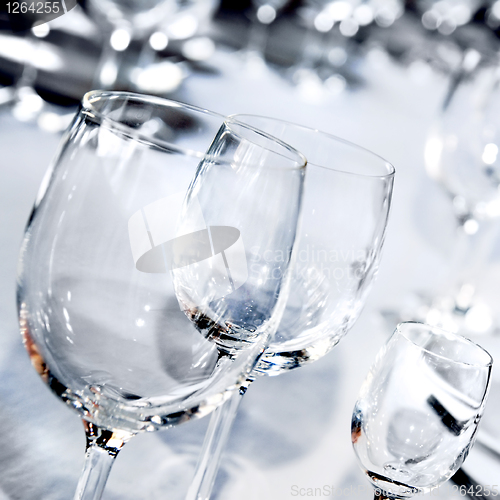 Image of Three glass goblets on white table