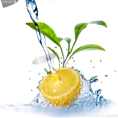Image of water drops on lemon with green leaves isolated on white