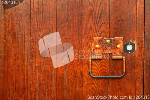 Image of handle on the wooden door