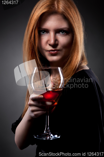 Image of woman with red hair holding wine glass