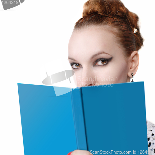 Image of portrait of attractive young woman with blue book