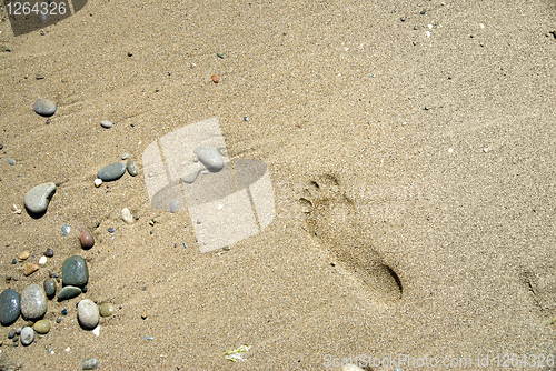 Image of sand stones with footprint