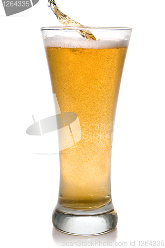 Image of Beer pouring into glass isolated on white