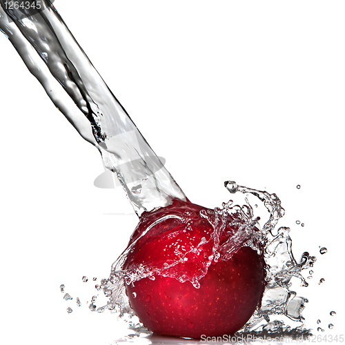 Image of Red apple and water splash isolated on white