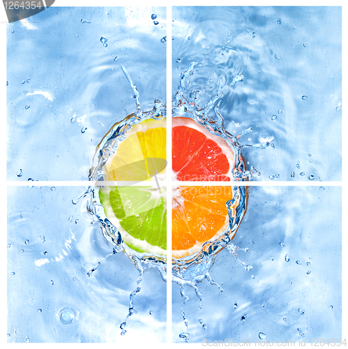 Image of mix of citrus dropped into water with bubbles isolated on white