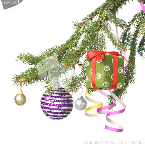 Image of Christmas balls, gift and decoration on fir tree branch isolated