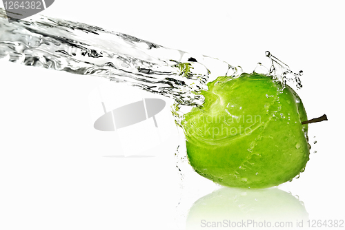 Image of fresh water splash on green apple isolated on white