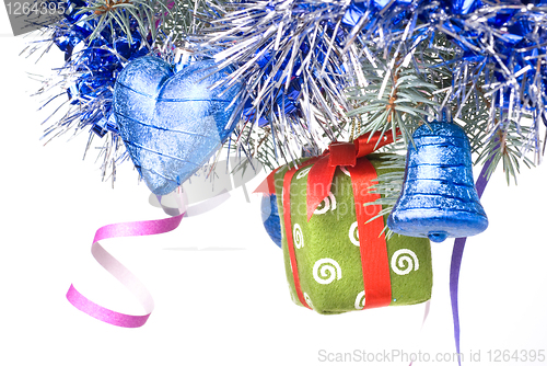 Image of Christmas balls, gift and decoration on fir tree branch isolated