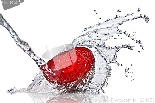 Image of red beet with water splash isolated on white