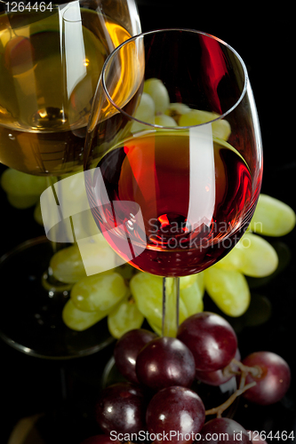 Image of Red and white wine in glasses with grape. Top view