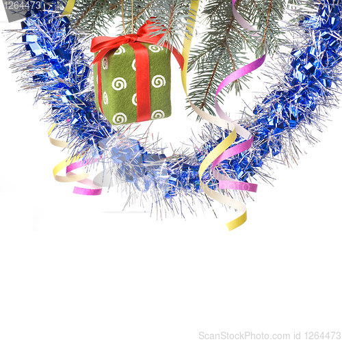 Image of Christmas gift and decoration on fir tree branch isolated on whi
