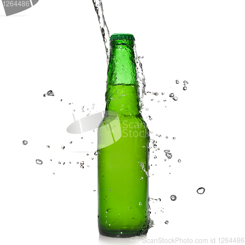 Image of Green beer bottle with water splash isolated on white