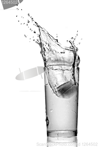 Image of water splash in glass isolated on white