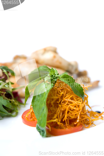 Image of carrot and tomato with green leaves