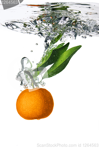 Image of Splash of orange to water with bubbles of air