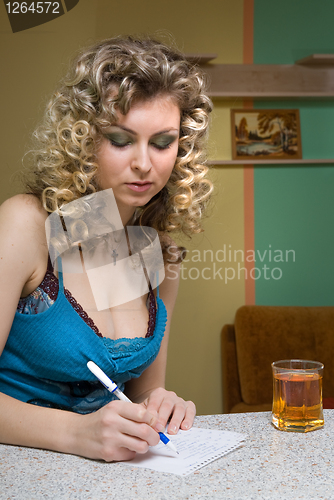 Image of young woman writing a notice
