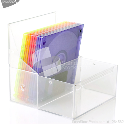 Image of Color floppy disks in box isolated on white