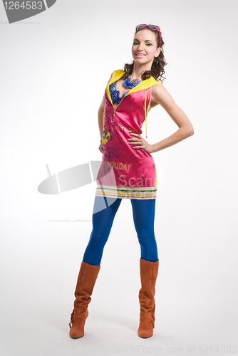 Image of Beautiful young woman posing in color wear