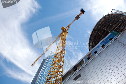 Image of Modern building under construction against blue sky