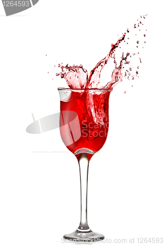 Image of splash of red wine in goblet isolated on white