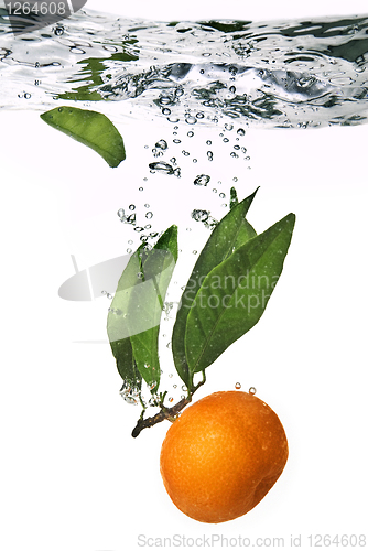 Image of Splash of orange to water with bubbles of air