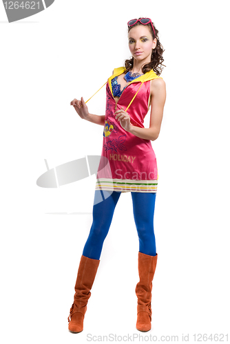 Image of Beautiful young woman in color wear on white