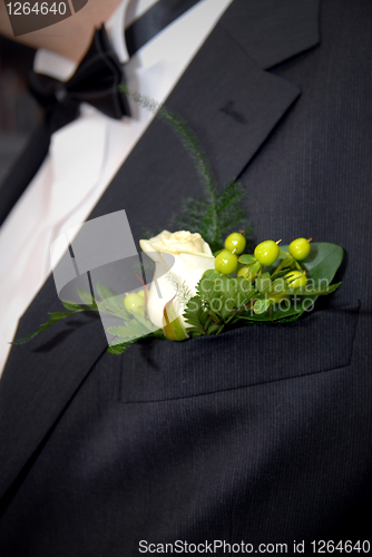 Image of wedding buttonhole with rose on mans suite