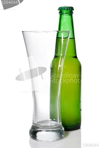 Image of Beer bottle and empty glass isolated on white