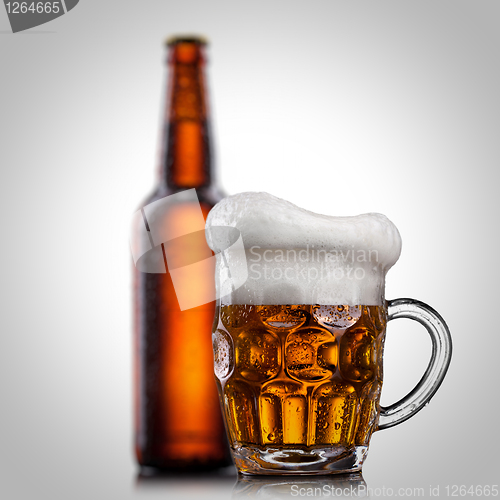Image of Beer in glass with water drops isolated on white 