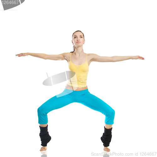 Image of beautiful girl doing gymnastics on white background