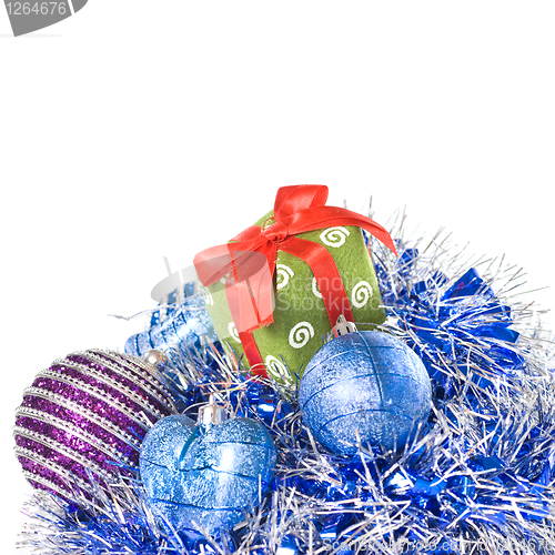 Image of christmas balls with and gift with decoration isolated on white