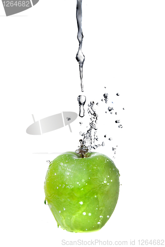 Image of fresh water splash on green apple isolated on white