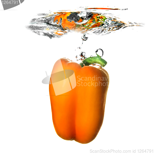 Image of Yellow pepper dropped into water with bubbles isolated on white