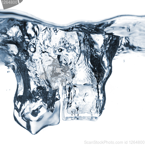 Image of ice cubes dropped into water with bubbles isolated on white
