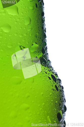 Image of Green beer bottle with water drops isolated on white