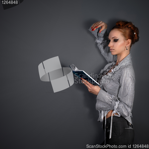 Image of attractive woman reading book