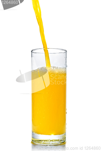 Image of orange juice poring into glass isolated on white