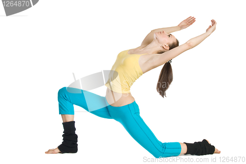 Image of beautiful girl doing gymnastics on white background