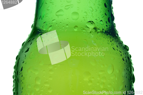 Image of Green beer bottle with water drops isolated on white