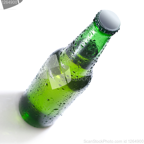 Image of Green beer bottle with water drops isolated on white