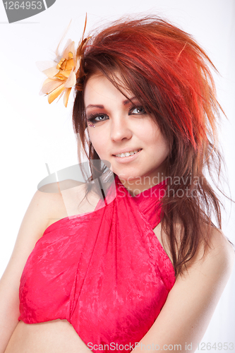 Image of Portrait of beautiful woman with spring flower in hair on white