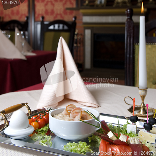 Image of English breakfast on the plate in restaurant