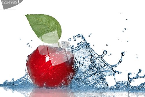 Image of Red apple and water splash isolated on white