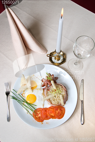 Image of English breakfast on the plate in restaurant