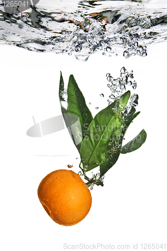 Image of Splash of orange to water with bubbles of air