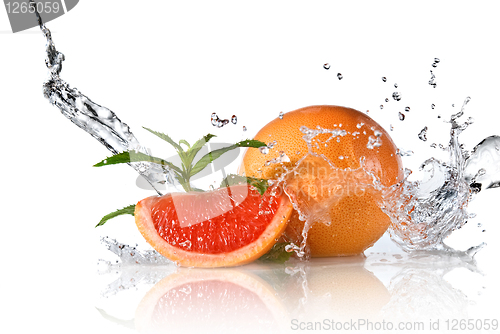 Image of Water splash on grapefruit with mint isolated on white