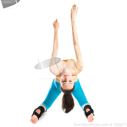 Image of beautiful girl doing gymnastics on white background